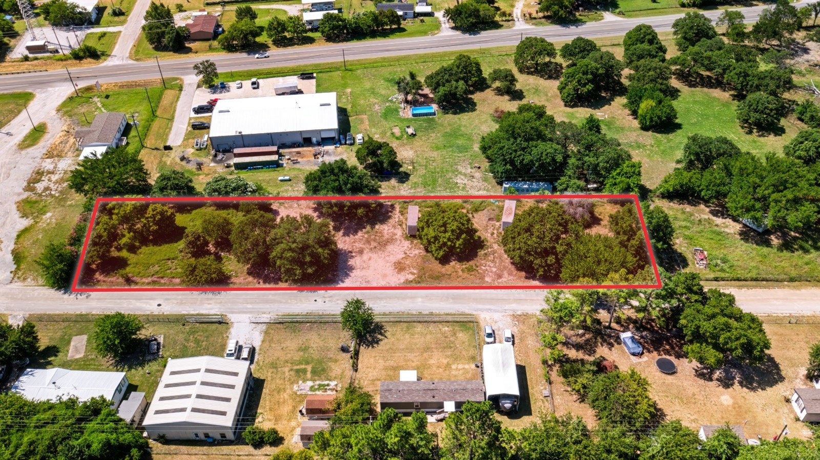 Aerial of 108 Angela St in Azle with the lot outlined in red